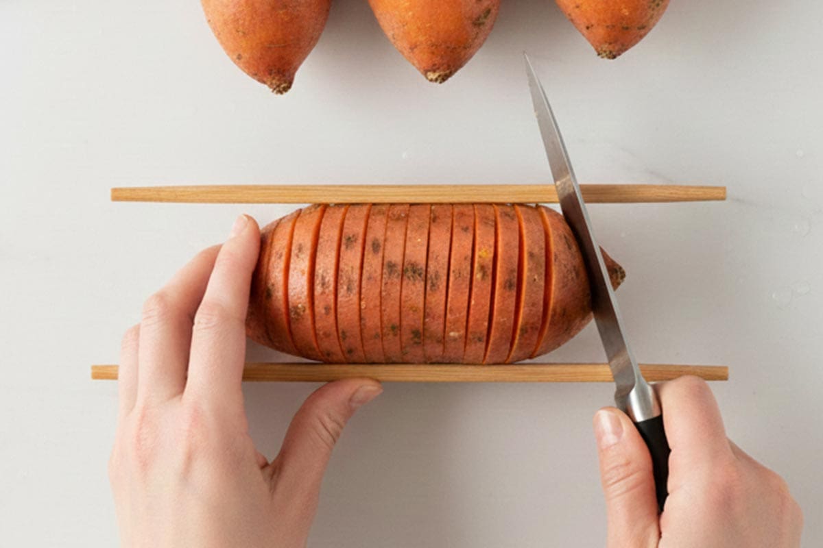 Slicing the potatoes.
