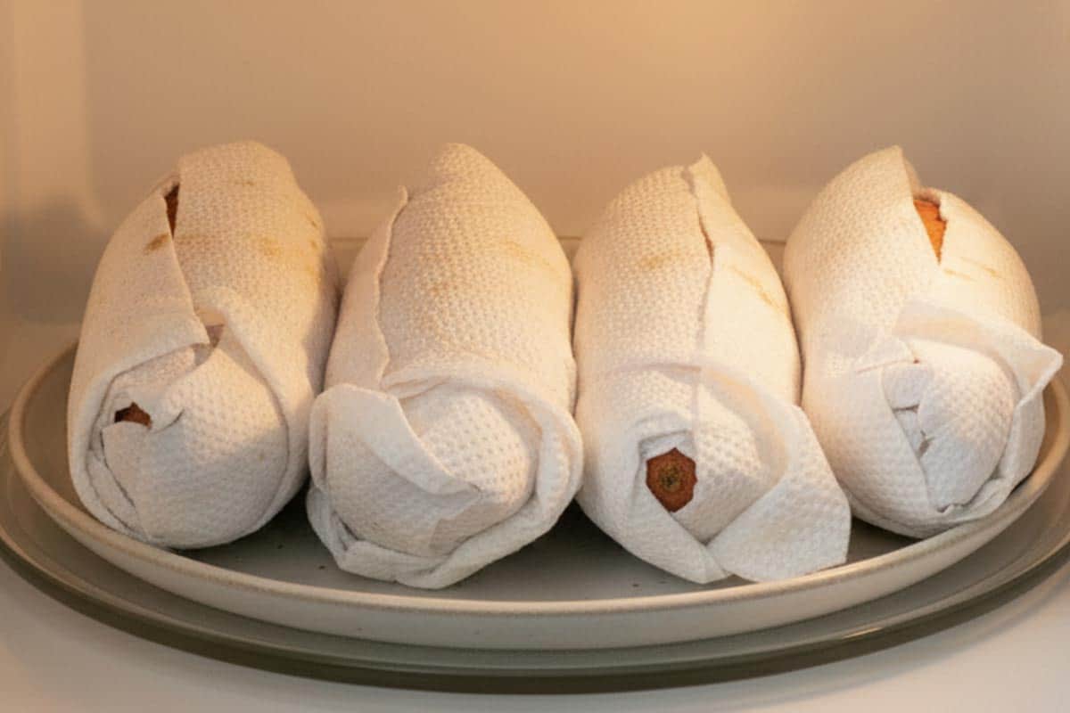 Wrapped the potatoes with paper towel and placed it on a microwave-safe dish.