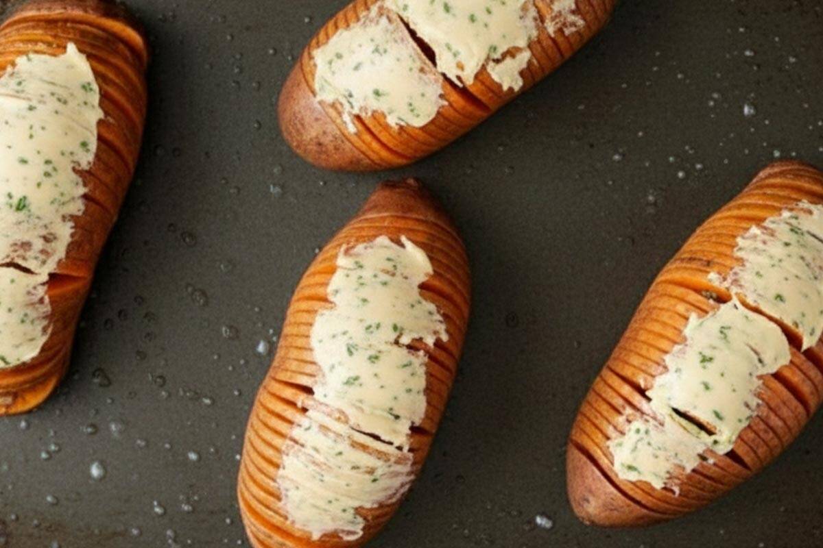 Carefully brushed the butter into the slices and over each potato.