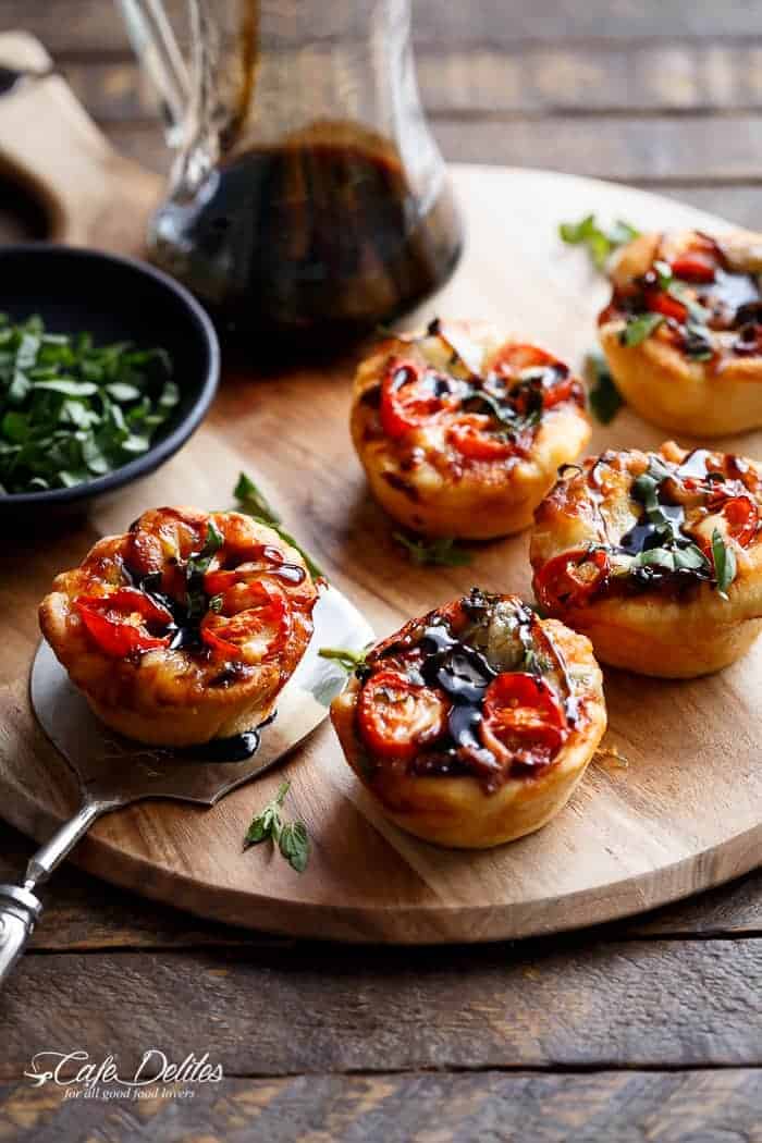 Caprese salad meets pizza in these delicious deep dish pizzas made easy in a humble standard muffin pan| https://cafedelites.com