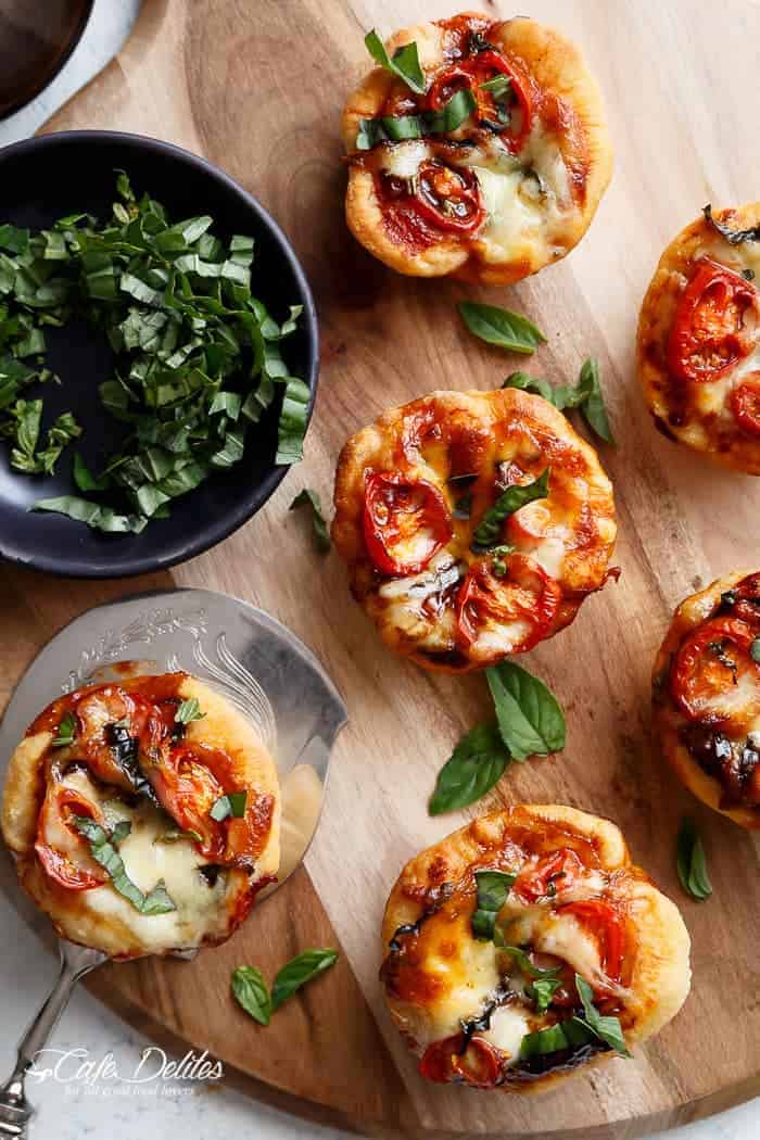 Caprese salad meets pizza in these delicious deep dish pizzas made easy in a humble standard muffin pan| https://cafedelites.com