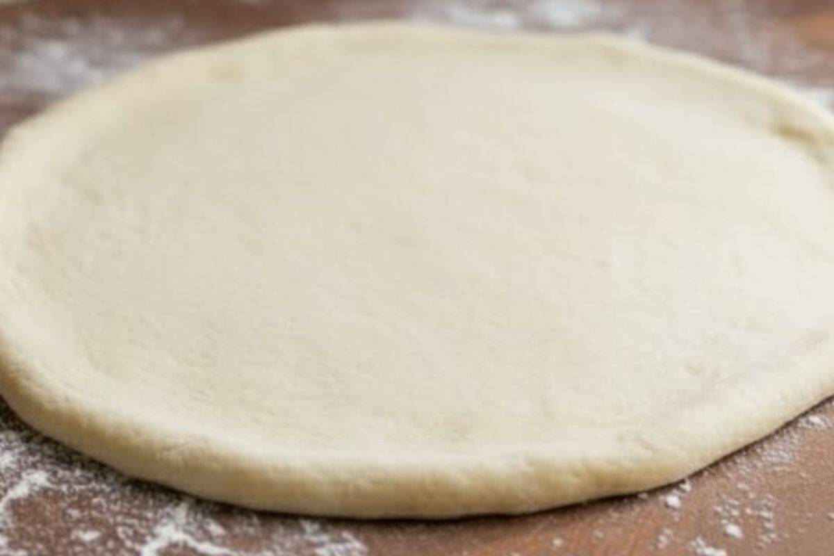 Place the dough on a lightly floured surface and let it come to room temperature so it's easy to roll.