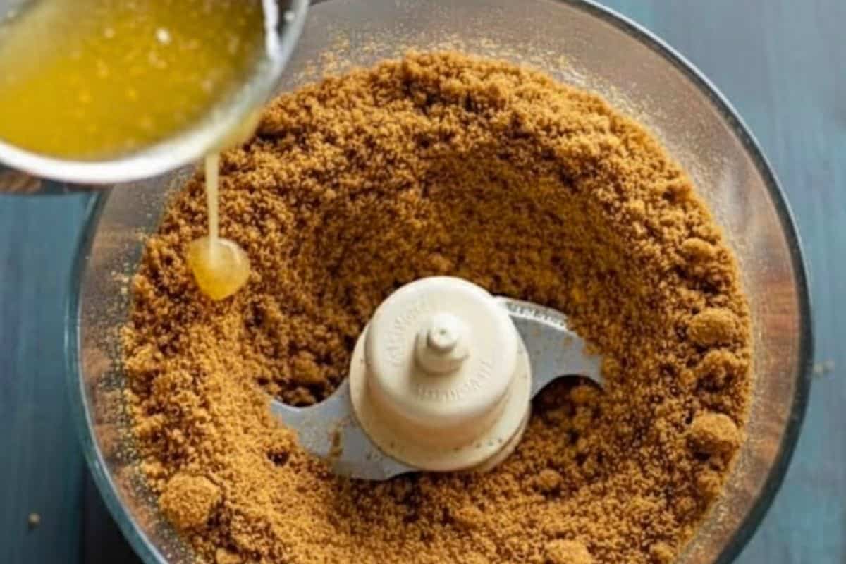 Place the gingerbread cookies in a food processor or blender and pulse until finely crushed. Add melted butter and mix 