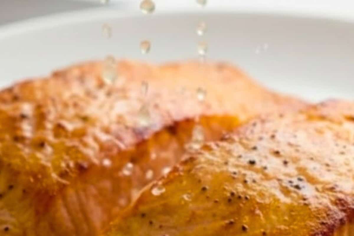 Transfer the salmon to a warm plate and squeeze lemon juice over each fillet.  - 6