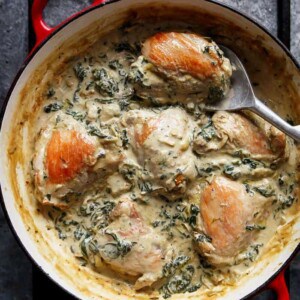 Creamy Spinach Artichoke Chicken Thighs in a pan