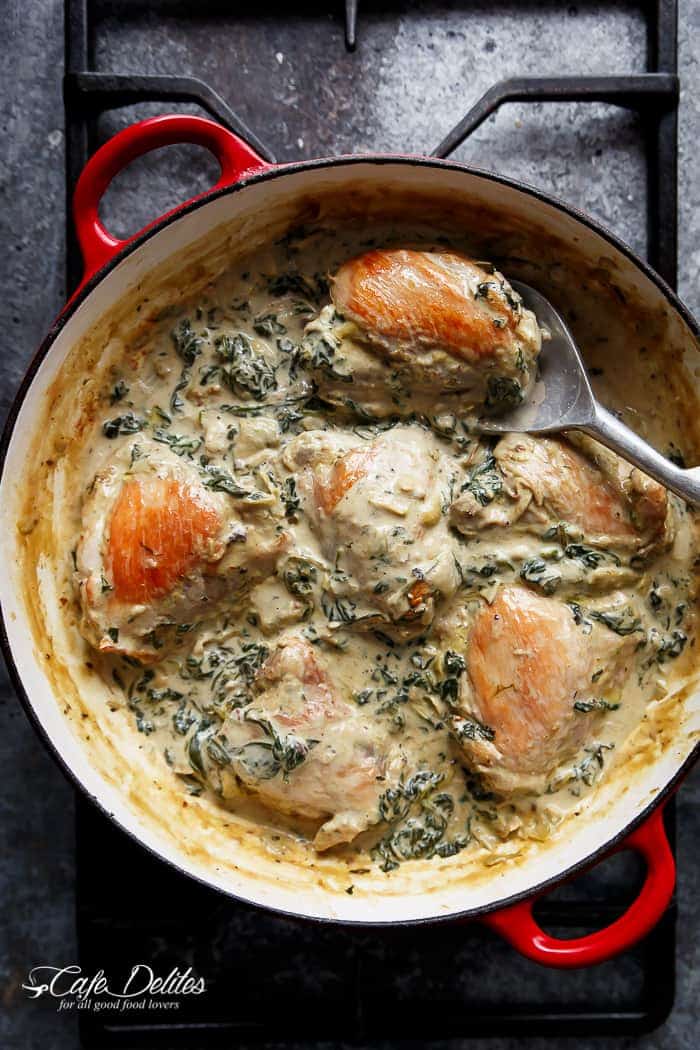 Creamy Spinach Artichoke Chicken Thighs in one skillet! Low fat AND low carb, filled with fresh spinach, artichokes, parmesan cheese and a hint of garlic! | https://cafedelites.com