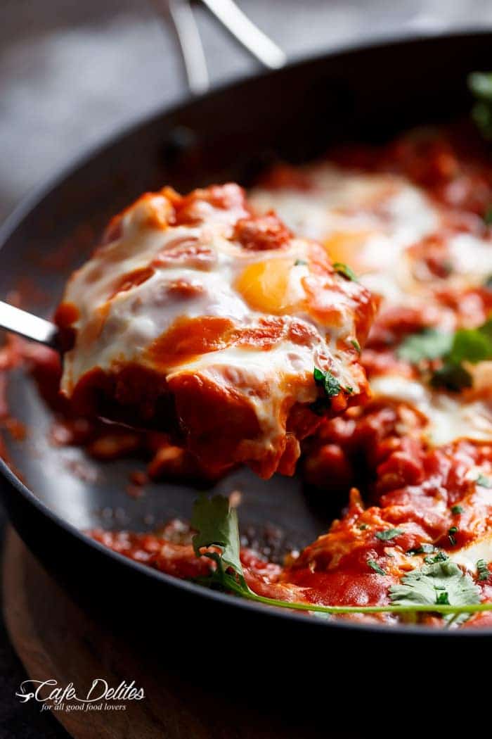 Eggs In Tomato Sauce (Shakshuka): thick, runny yolk meets rich tomato sauce. This is some good, fiery comfort food.