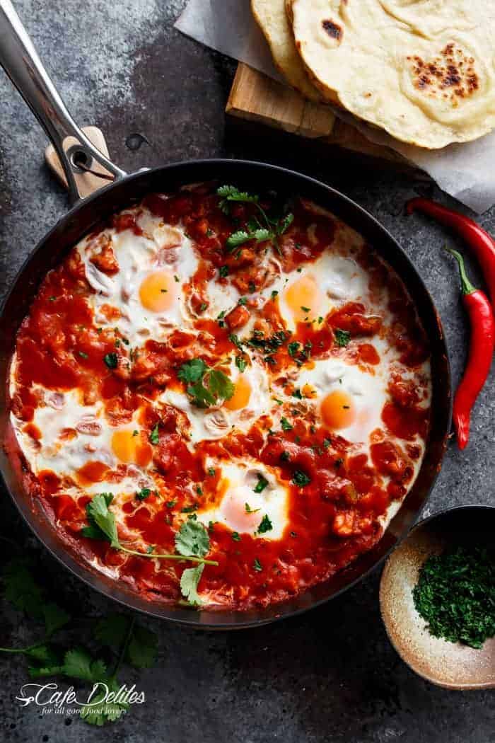 Eggs In Tomato Sauce (Shakshuka): thick, runny yolk meets rich tomato sauce. This is some good, fiery comfort food.