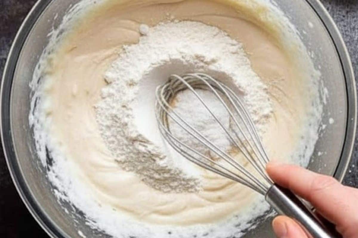 Create a well in the center, add flour, salt, and baking soda