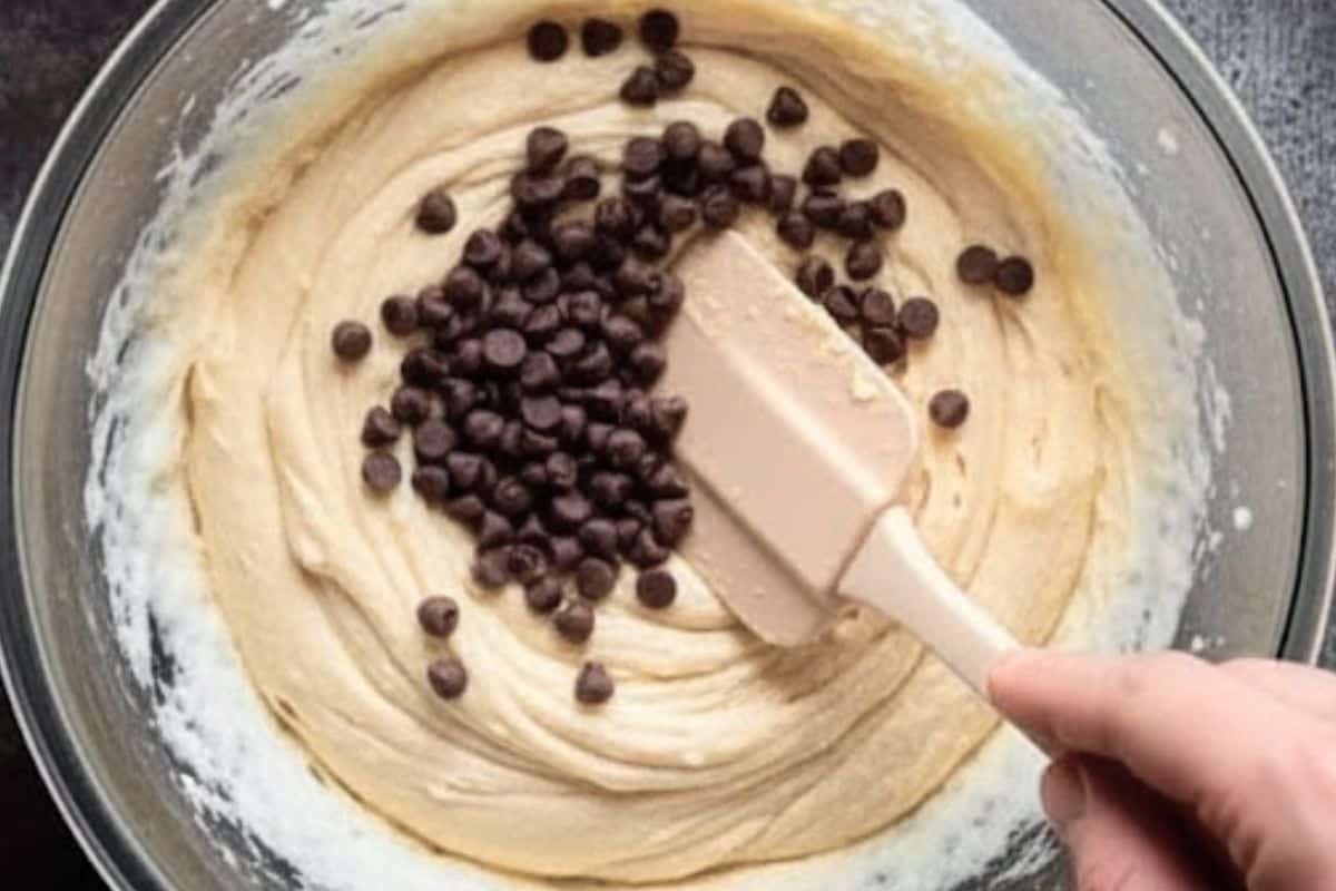 Gently fold in 1/4 cup of the mini chocolate chips into the batter.
