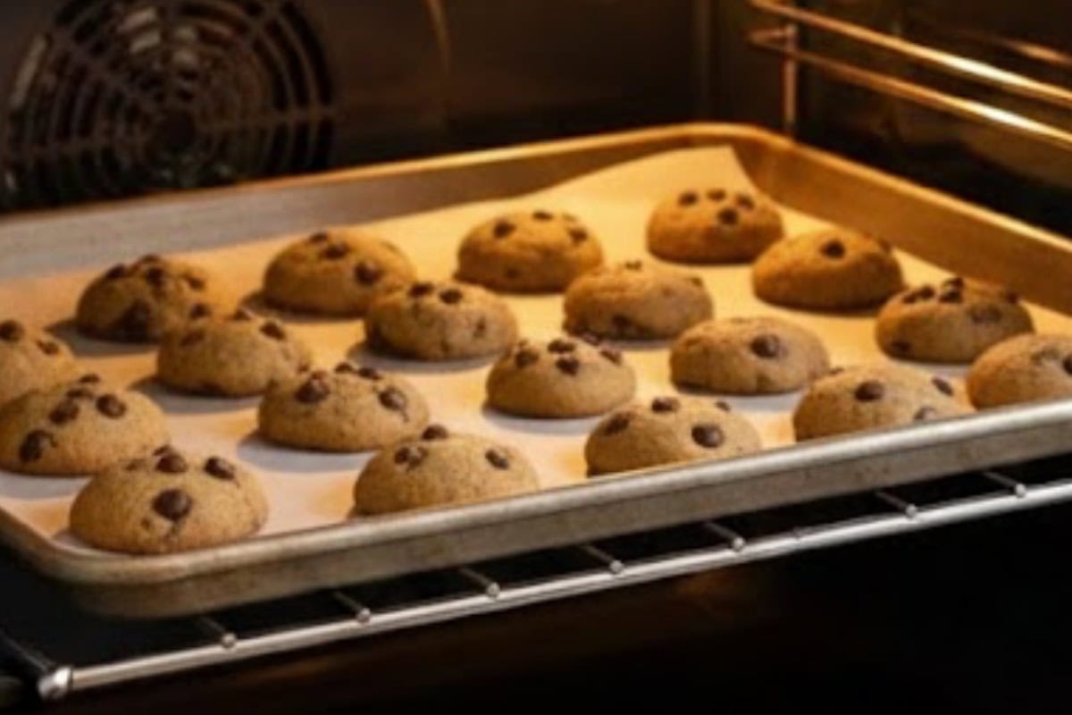 Scoop 1/2-teaspoon of dough, roll into balls, place on the baking sheet, top with chocolate chips, and bake for 10 minutes.