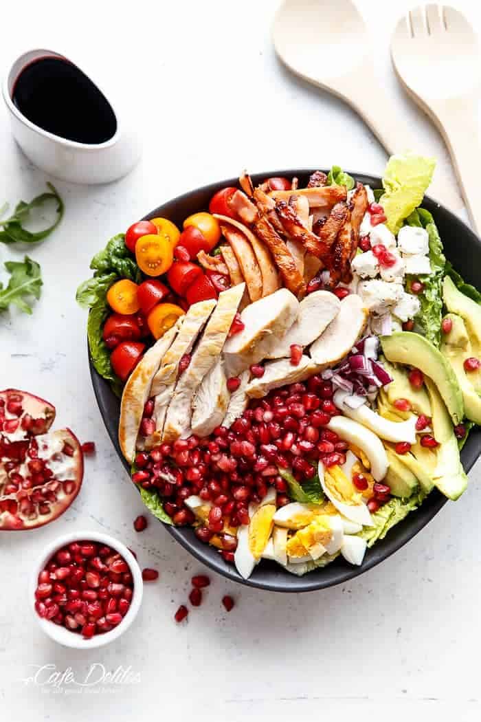 Much like a Cobb Salad, throwing all sorts of fresh ingredients into a bowl, making it lighter, lower in fat and healthy with an abundance of Pomegranates! Only 303 calories per a main sized serve, or 8 Weight Watchers SP! | https://cafedelites.com