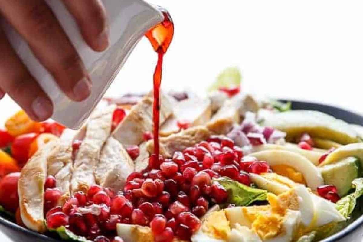 Whisk the dressing ingredients in a jug until smooth, then pour over the salad.