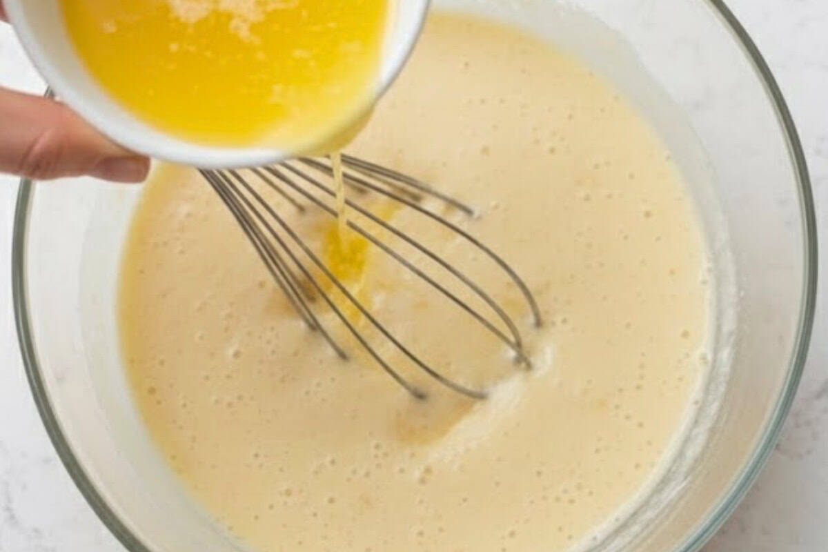 Whisk melted butter into the wet mixture, then pour into the dry ingredients  - 6
