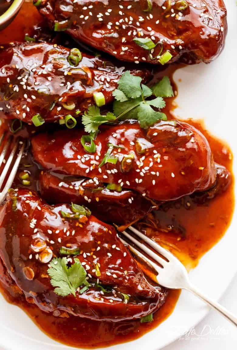 Slow Cooker Asian Glazed Chicken Breasts (or chicken thighs) for those 'throw it all in the slow cooker' days and let something else worry about your dinner! Fall apart tender chicken breast filling your house with sweet, honey garlic aromas, perfectly slow cooked and waiting for you when you get home. | cafedelites.com