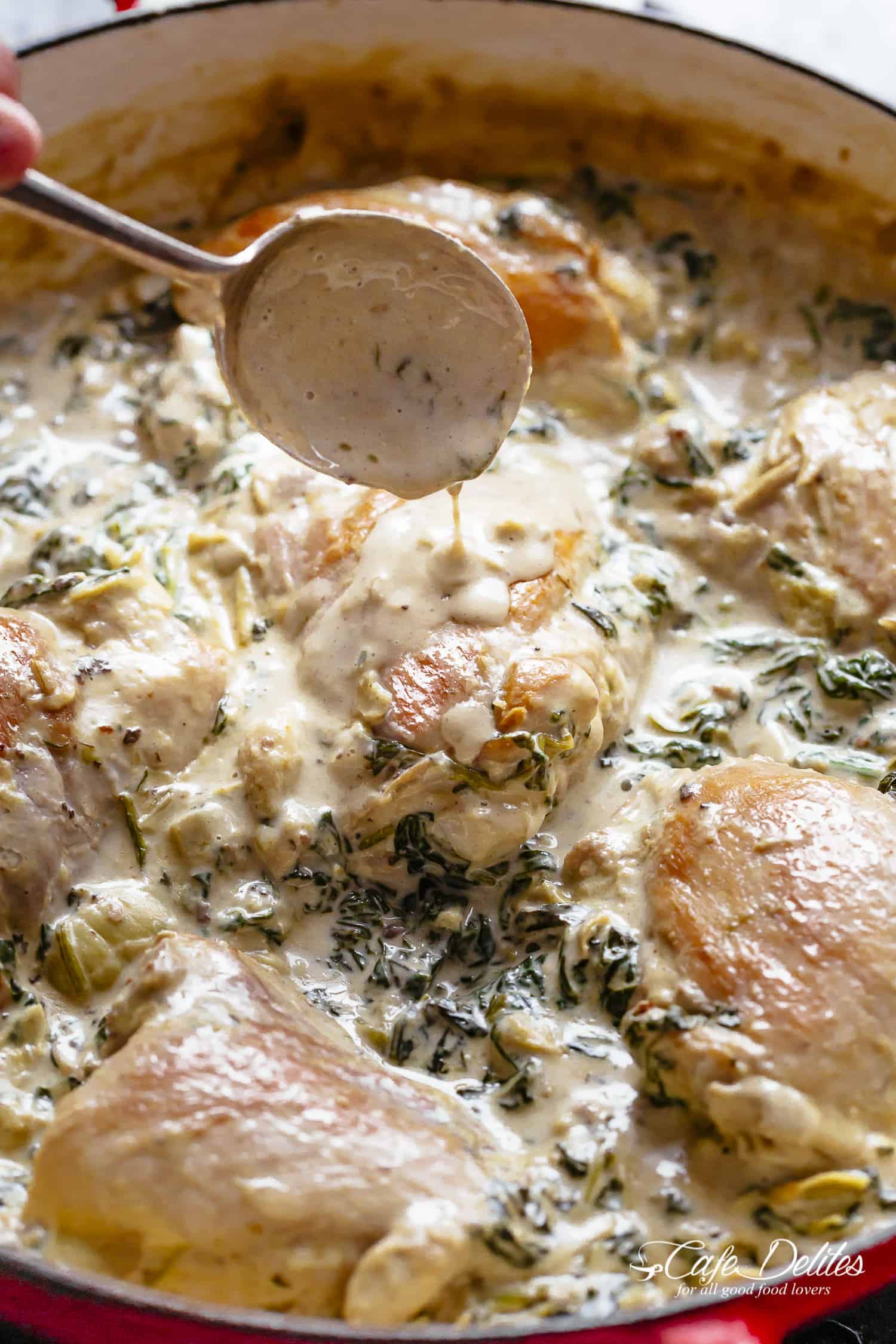 Creamy Spinach Artichoke Chicken Thighs in one skillet! Low fat AND low carb, filled with fresh spinach, artichokes, parmesan cheese and a hint of garlic! | cafedelites.com