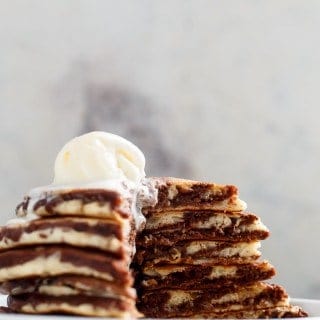 Zebra Marble Pancakes are a step up from normal pancakes and a twist on the popular Zebra cake! Incredibly easy to make AND perfectly fluffy! | https://cafedelites.com