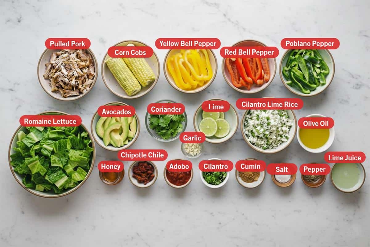 Top shot of ingredients: Pulled pork, corn cobs, yellow bell pepper, red bell pepper, poblano pepper, romaine lettuce, avocados, coriander, lime, cilantro lime rice, olive oil, honey, chipotle chile, adobo, garlic, cilantro, cumin, salt, pepper, and lime juice. - 2