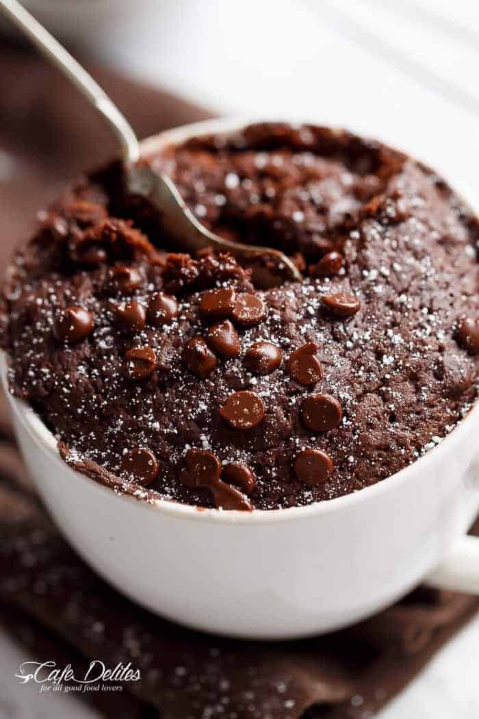 Low Fat Double Chocolate Mug Cake recipe WITH another video. Ready in less than one minute! Fluffy. Buttery and soft. The BEST low fat, guilt-free mug cake! | https://cafedelites.com