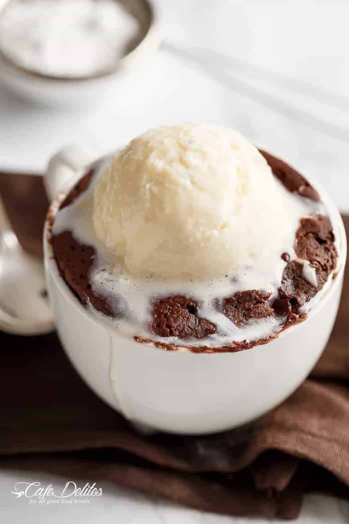 Low Fat Double Chocolate Mug Cake recipe WITH another video. Ready in less than one minute! Fluffy. Buttery and soft. The BEST low fat, guilt-free mug cake! | https://cafedelites.com