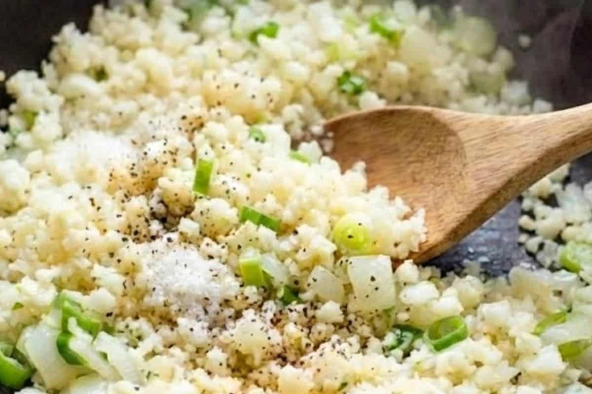 Stir the cauliflower rice into the pan and season with salt and pepper. - 6
