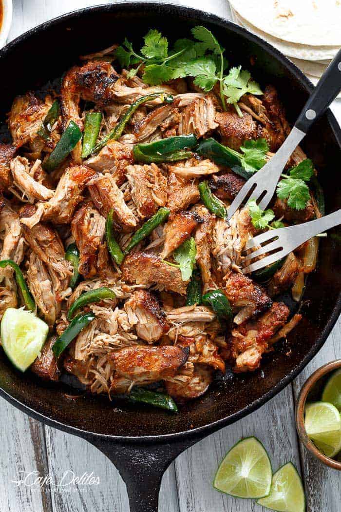 Crispy Slow Cooker Carnitas (Mexican Pulled Pork) so tender an falling apart smothered in so much flavour, you won't be able to put your forks down! | http://cafedelites.com