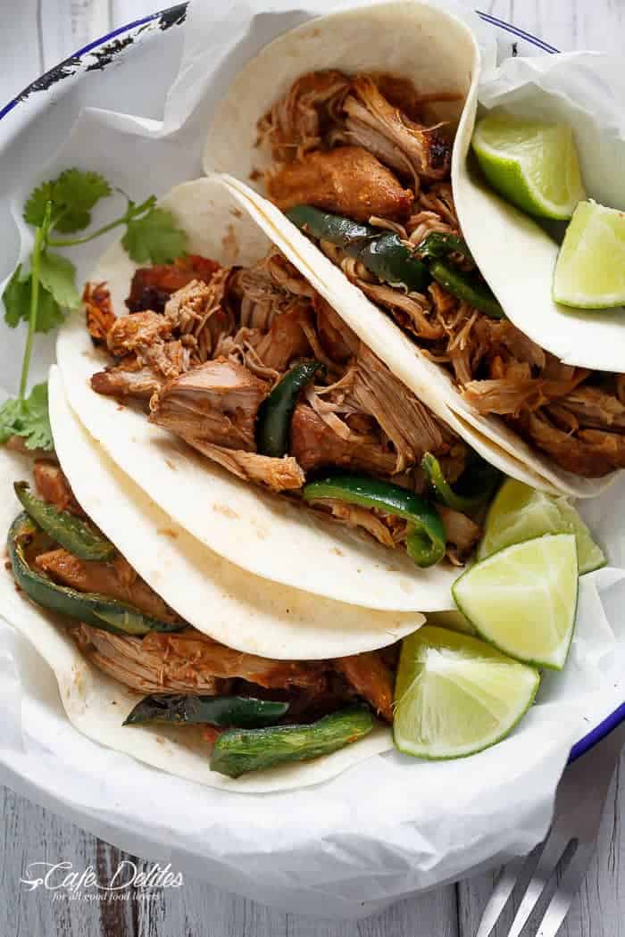 Crispy Slow Cooker Carnitas (Mexican Pulled Pork) so tender an falling apart smothered in so much flavour, you won't be able to put your forks down! | https://cafedelites.com