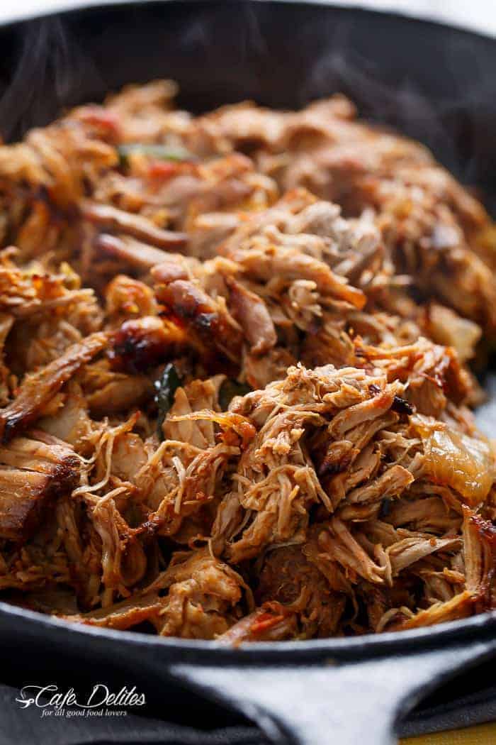 Crispy Slow Cooker Carnitas (Mexican Pulled Pork) so tender an falling apart smothered in so much flavour, you won't be able to put your forks down! | http://cafedelites.com