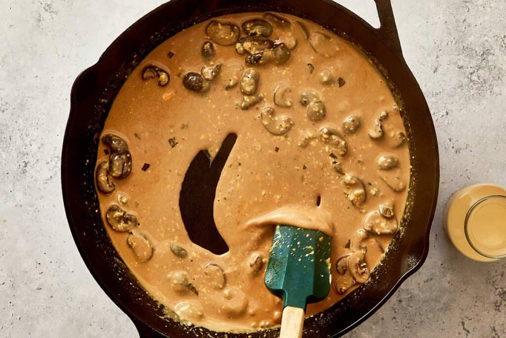 simmering mushroom and evaporated milk