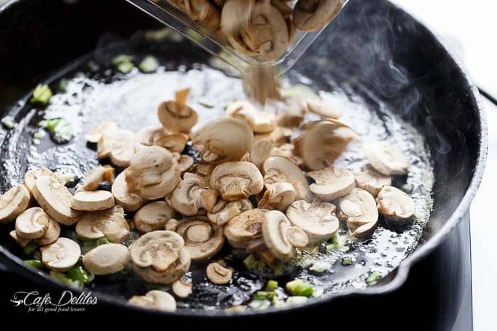 Lightened up to indulge in more! Julia Child's Creamy Chicken + Mushroom (also known as Supremes De Volaille Aux Champignons), gets a lower fat make over and is cooked in one skillet! | https://cafedelites.com