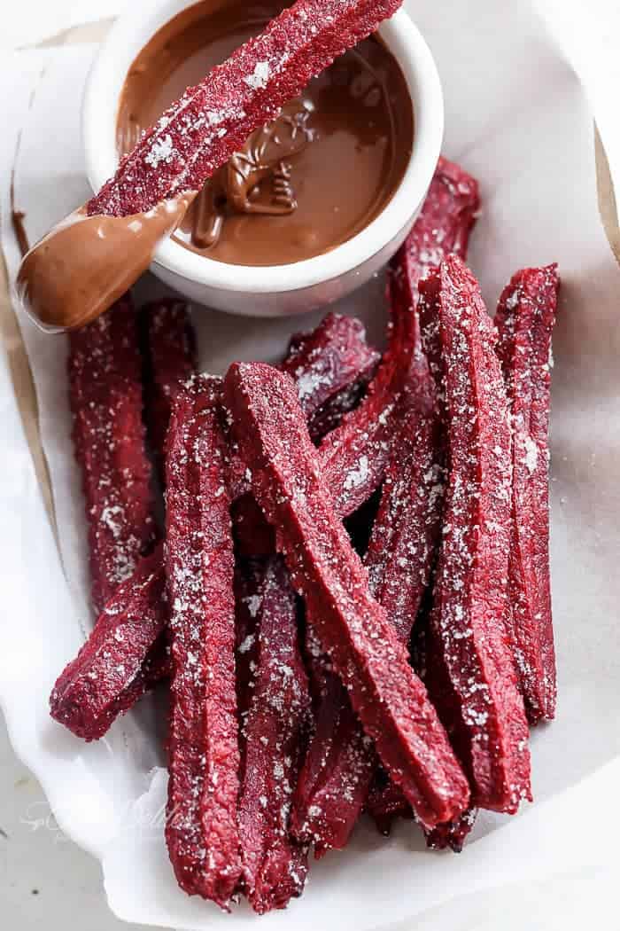 The Best Red Velvet Churros... now you can make them at home with a Red Velvet Twist! Just like store-bought Churros. BUT BAKED not fried and only 36 calories EACH! | https://cafedelites.com