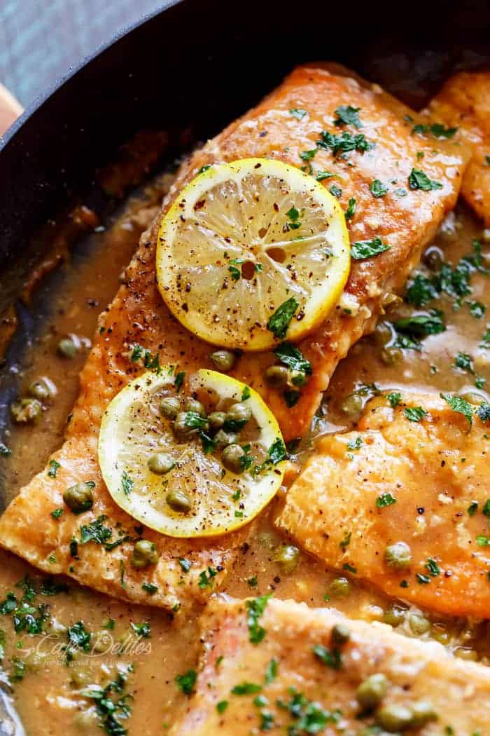 A lightened up, Easy Salmon Piccata with all of the authentic Piccata flavours of white wine, capers, lemon and garlic. Gourmet cooking in minutes! | https://cafedelites.com