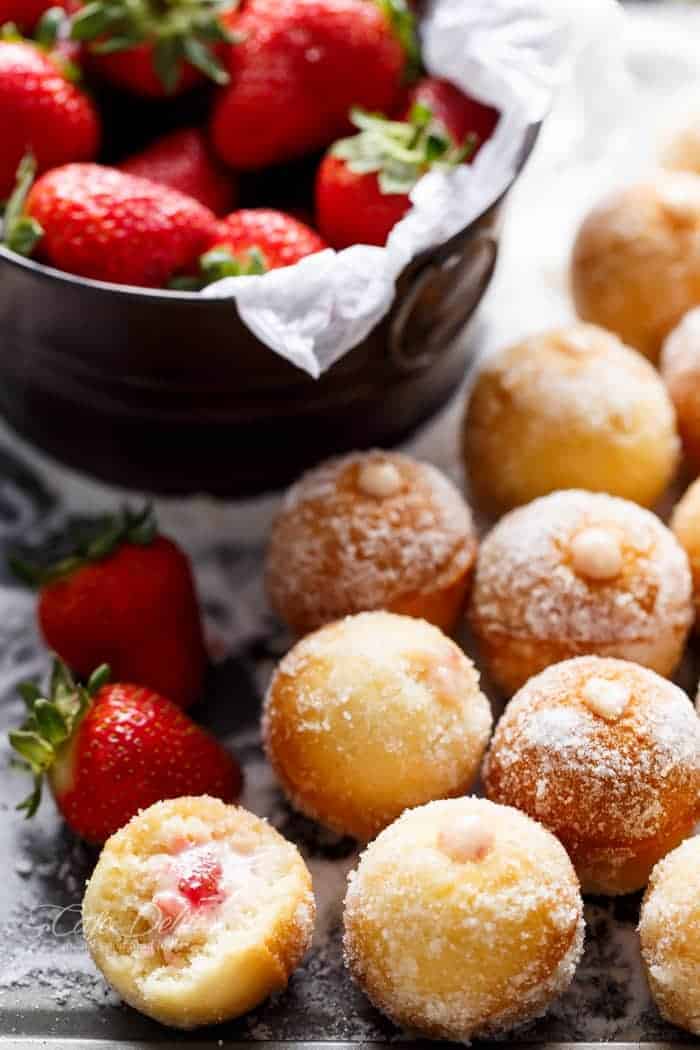 Strawberry Cheesecake Donut Holes with some fresh strawberries 