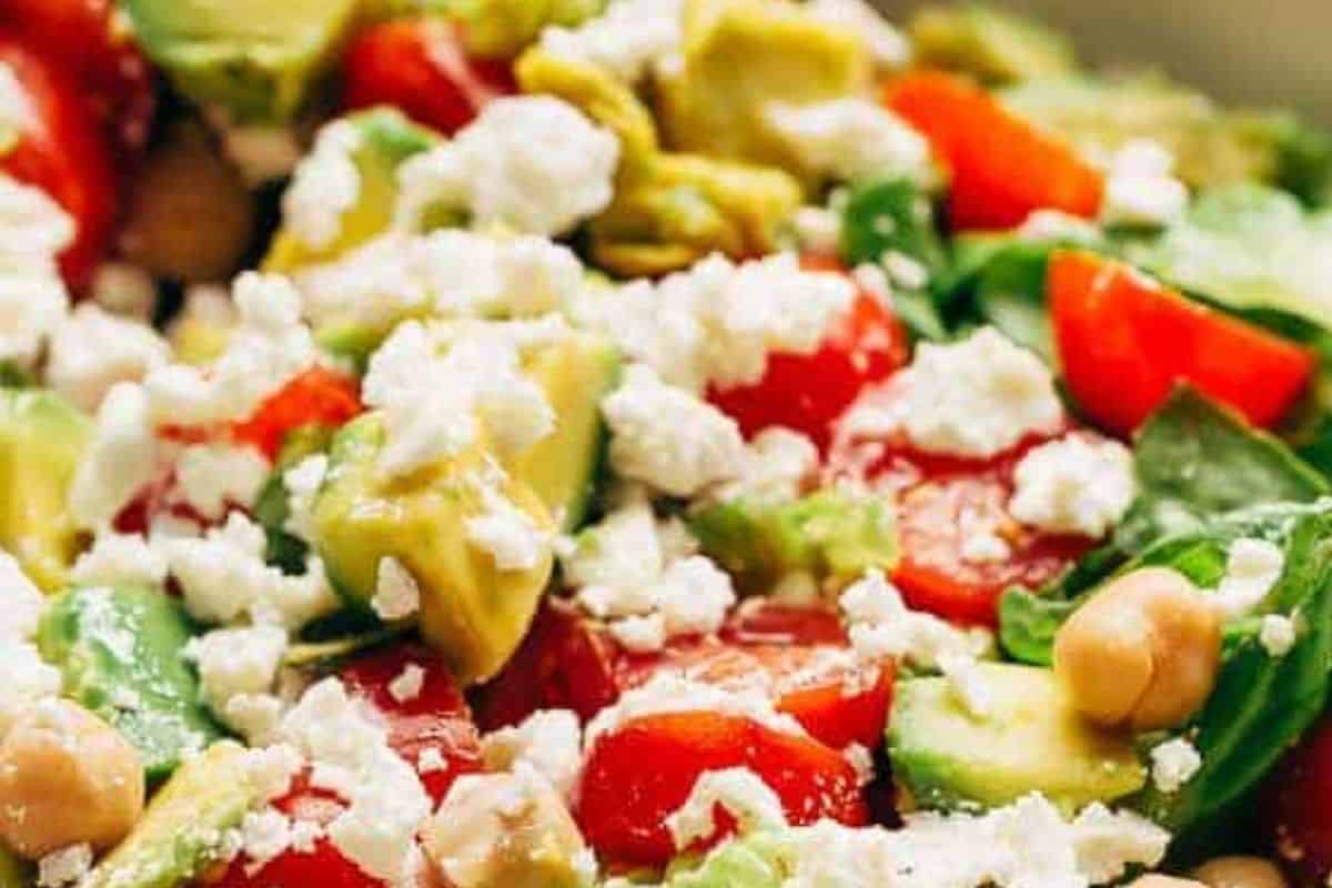 In a medium bowl, add romaine lettuce, chickpeas, grape tomatoes, feta, and avocado, and combine.