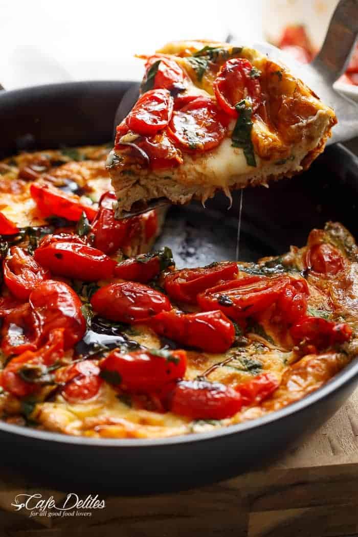 Garlic infused, Caprese Frittata with pan fried, juicy tomato and fresh basil flavors. Breakfast, brunch, lunch or dinner! Easy to make and low carb/cal! | https://cafedelites.com