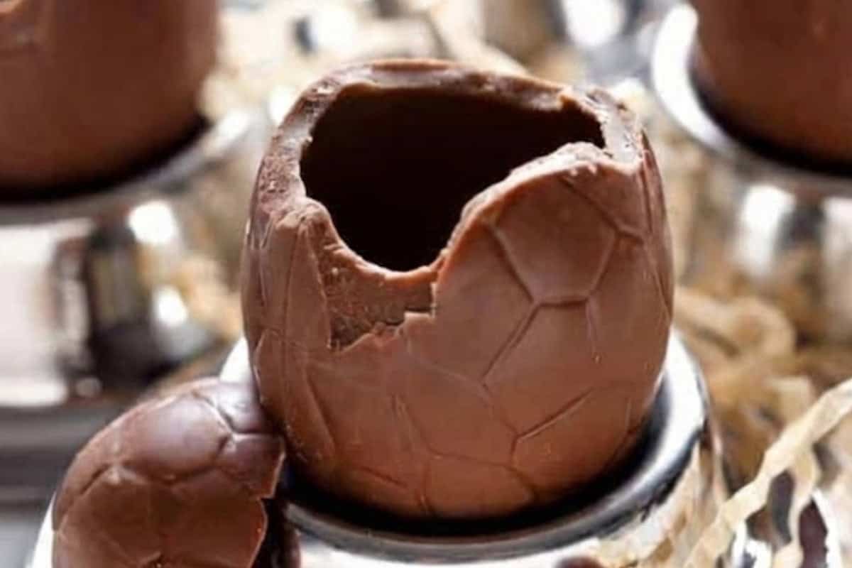 Using a sharp, non serrated knife, carefully remove the tops of the hollow chocolate eggs. Work slowly and gently to avoid cracking the shells, and set the tops aside