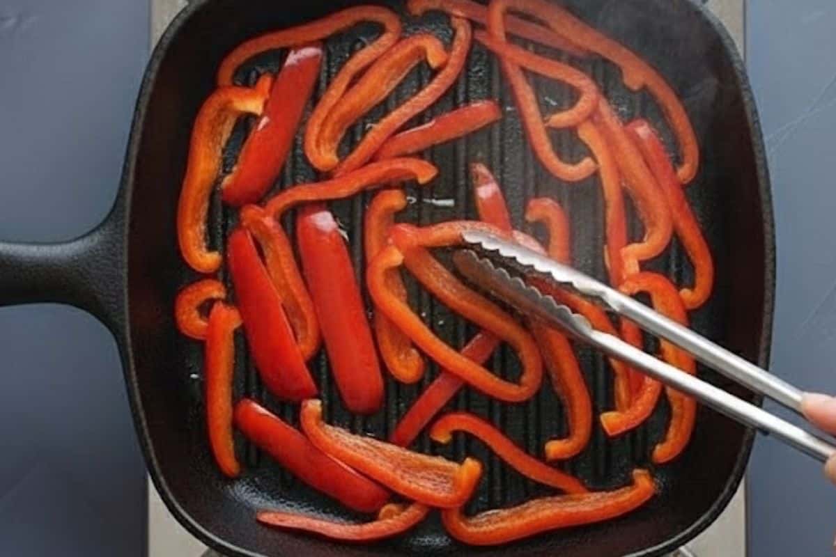 Wipe the pan clean, add another teaspoon of oil, and grill or fry the red peppers.
