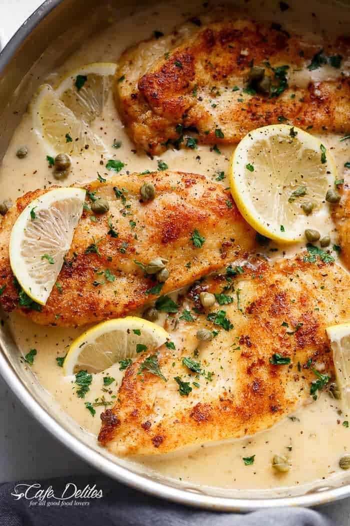 The ultimate in gourmet comfort food with parmesan cheese, garlic and a creamy lemon sauce, this Creamy Lemon Parmesan Chicken Piccata is out of this world. With NO heavy cream! | https://cafedelites.com
