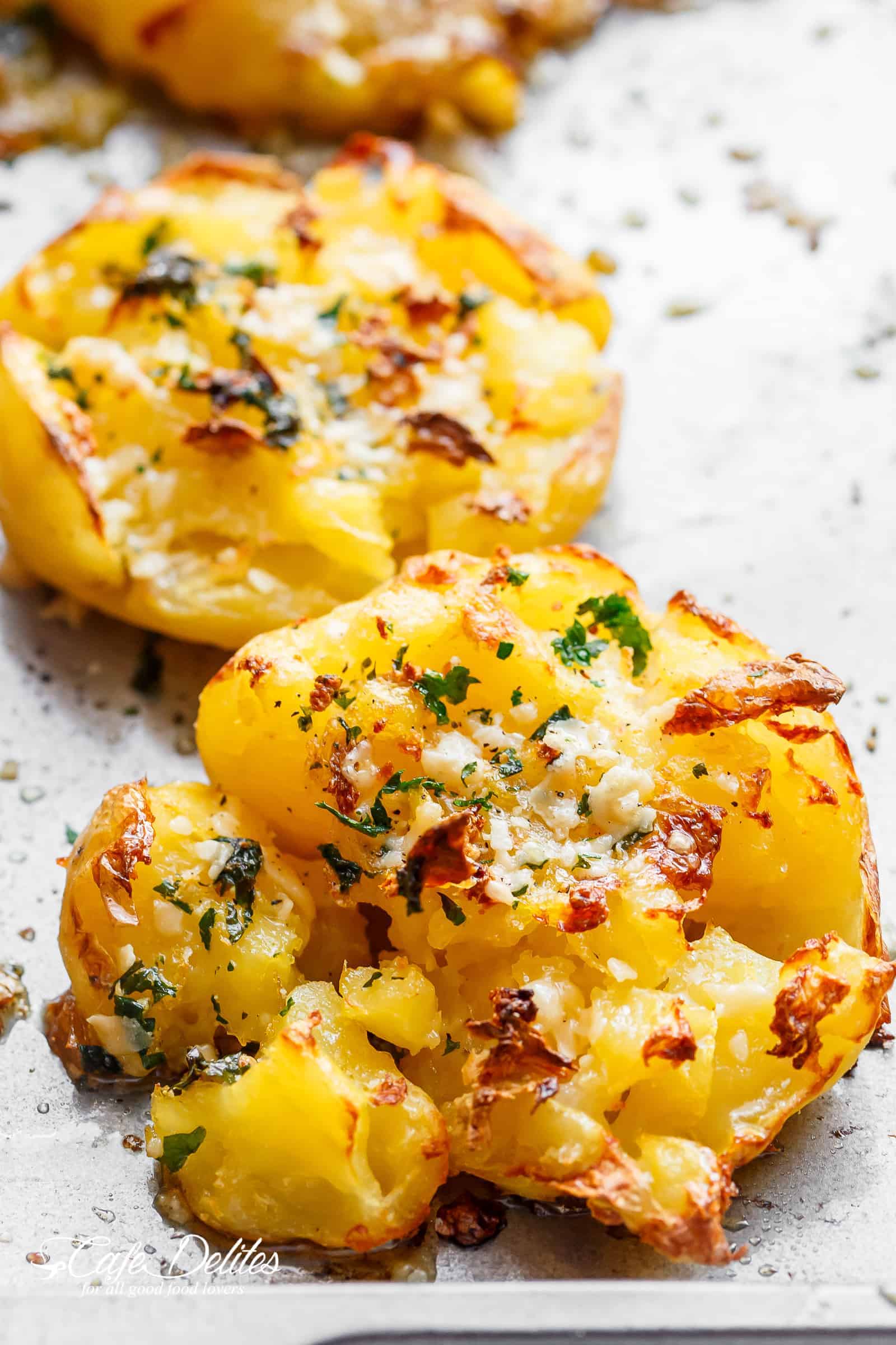 Crispy Garlic Butter Parmesan Smashed Potatoes | https://cafedelites.com