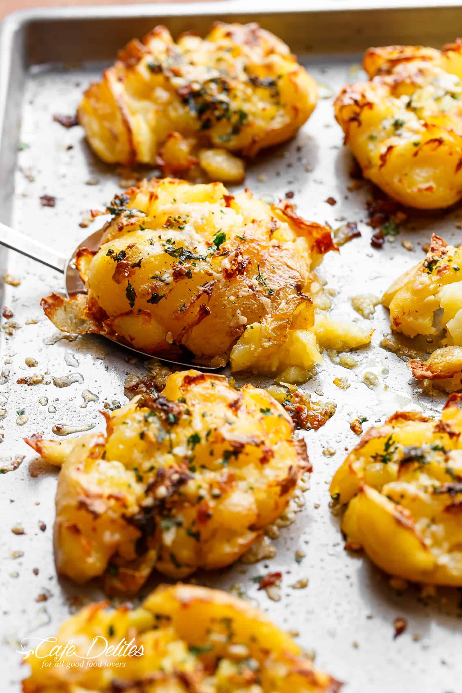 Oven Baked Easy Crispy Garlic Butter Parmesan Smashed Potatoes | https://cafedelites.com