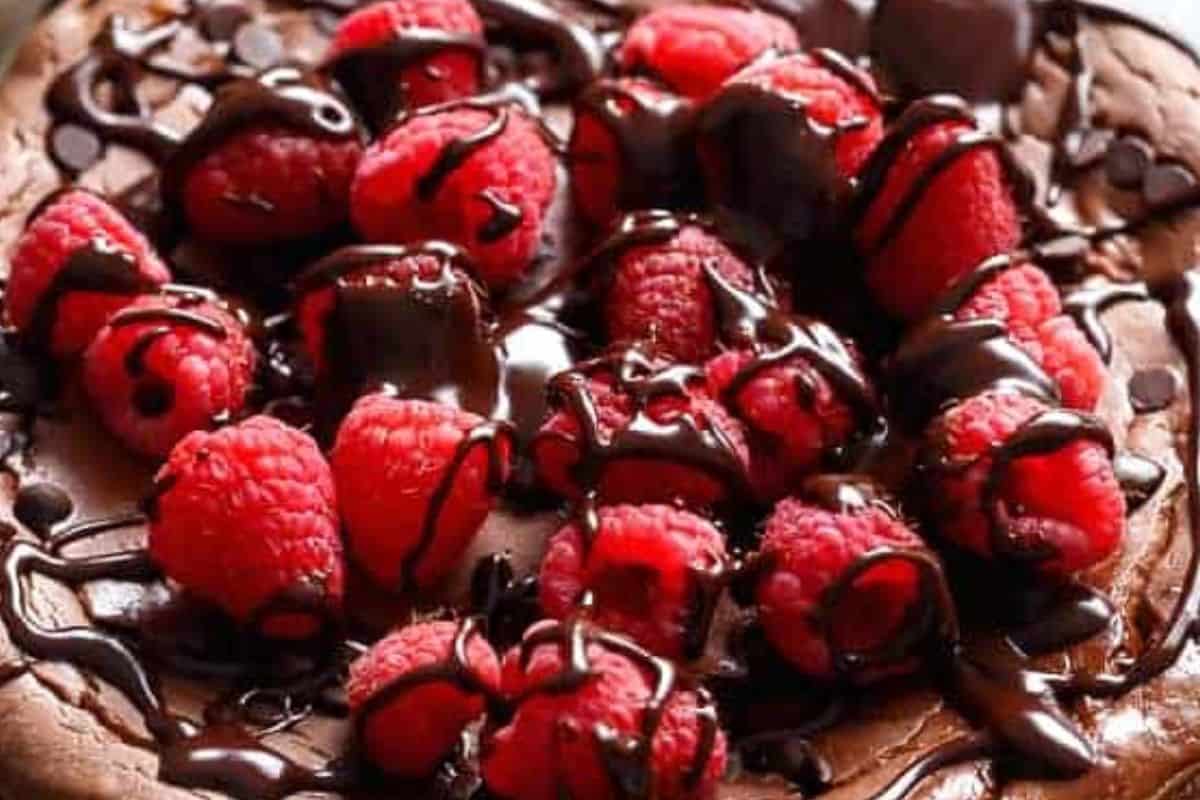Cool completely on a wire rack, refrigerate for several hours or overnight, then top with raspberries and melted chocolate.