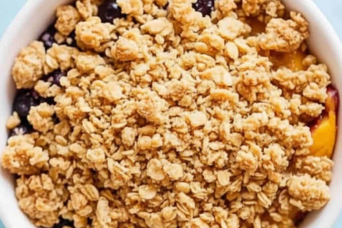 Spread the crumble mixture over the fruit.