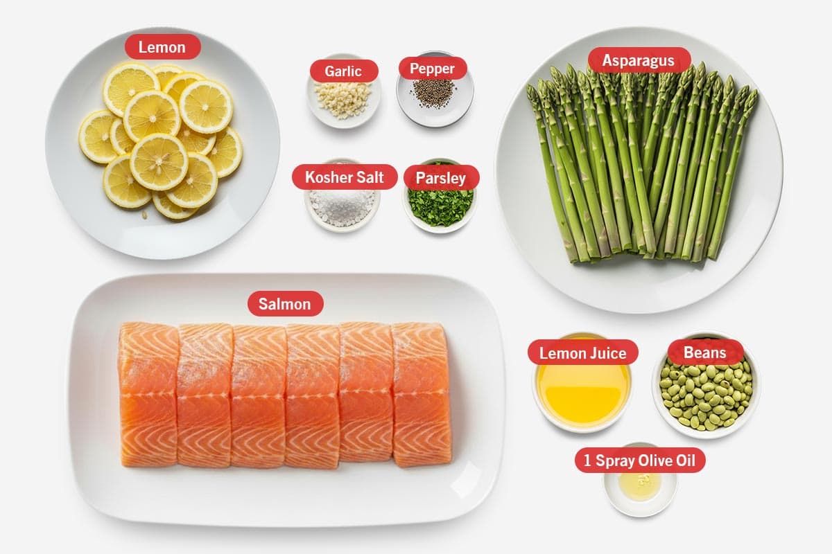 Top shot of ingredients: Lemon, garlic, pepper, kosher salt, parsley, asparagus, salmon, lemon juice, beans, 1 spray olice oil.