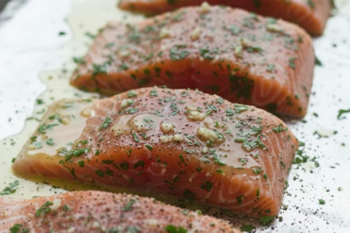 Salmon fillets coated with seasoning.