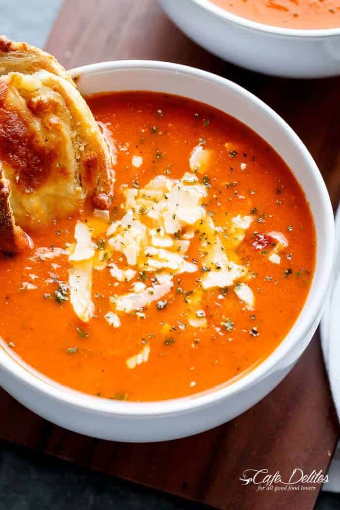 A Creamy Roasted Tomato Basil Soup full of incredible flavours, naturally thickened with no need for cream cheese or heavy creams! | https://cafedelites.com