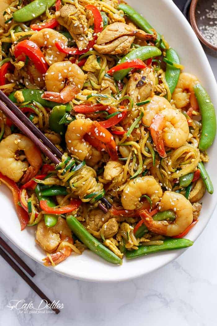 A twist on the classic Singapore Noodles -- same classic flavours only low carb and low calories with Singapore Zoodles! | https://cafedelites.com