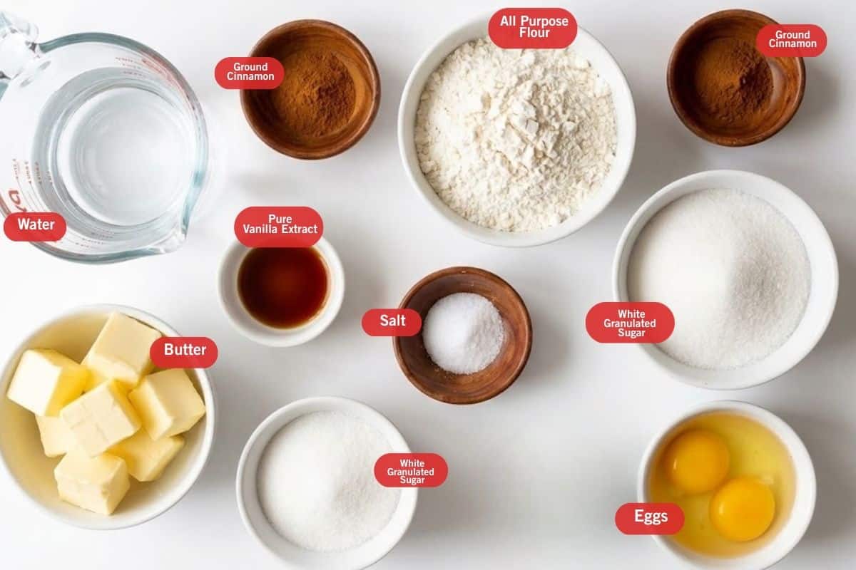 Flat lay photo of ingredient shot of butter, water, pure vanilla extract, ground cinnamon, salt, all purpose flour, eggs, sugar, ground cinnamon