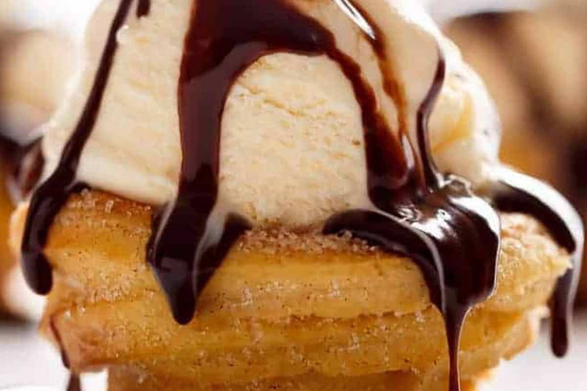 Let the churro cups cool, roll them in cinnamon sugar while warm, and fill with ice cream, fruit, or any topping