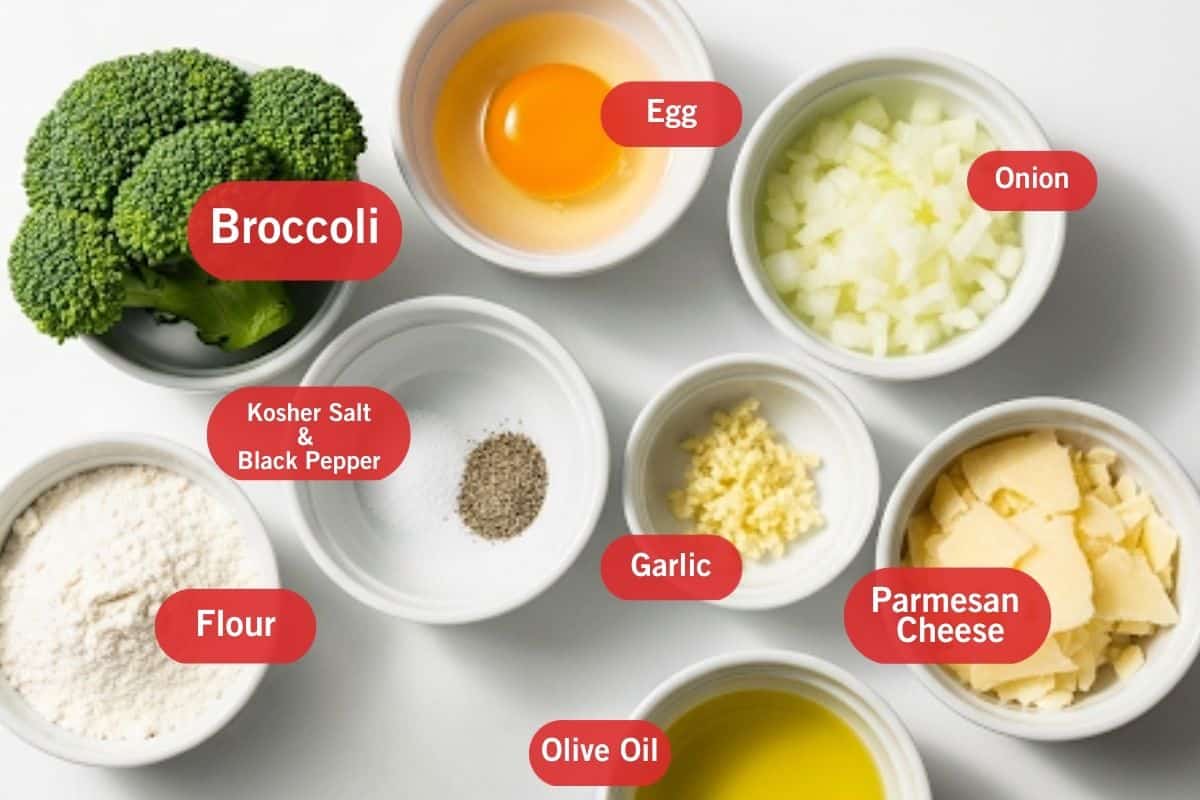 Flat lay photo of ingredient shot of large broccoli, egg, onion, flour, kosher salt and black pepper, garlic, parmesan cheese, olive oil