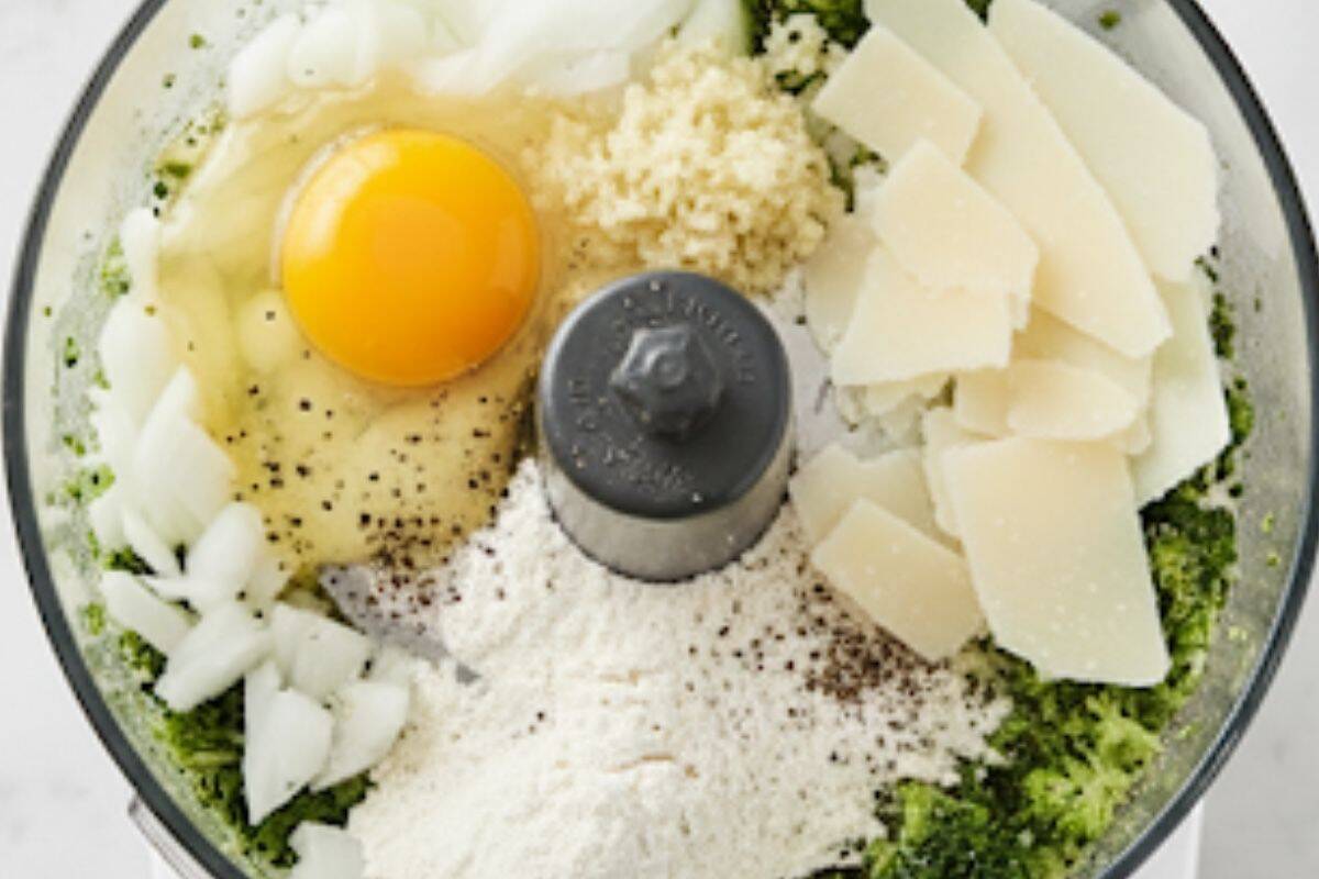 Add the egg, onion, garlic, flour, and Parmesan to the food processor.